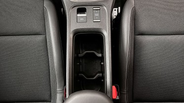 There is a lot of storage room between the front seats, which is very useful for small items.