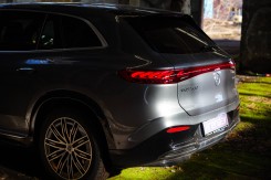 The rear of the EQS SUV looks cool at night with its signature lighting.