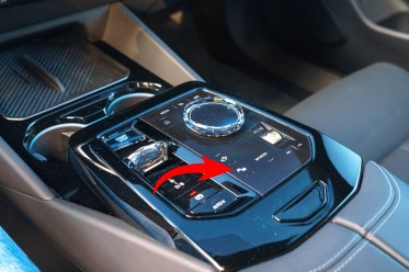 First you press a button on the center console, then the center screen controls.