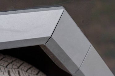 The charge port is small and integrated into the wheel arch.
