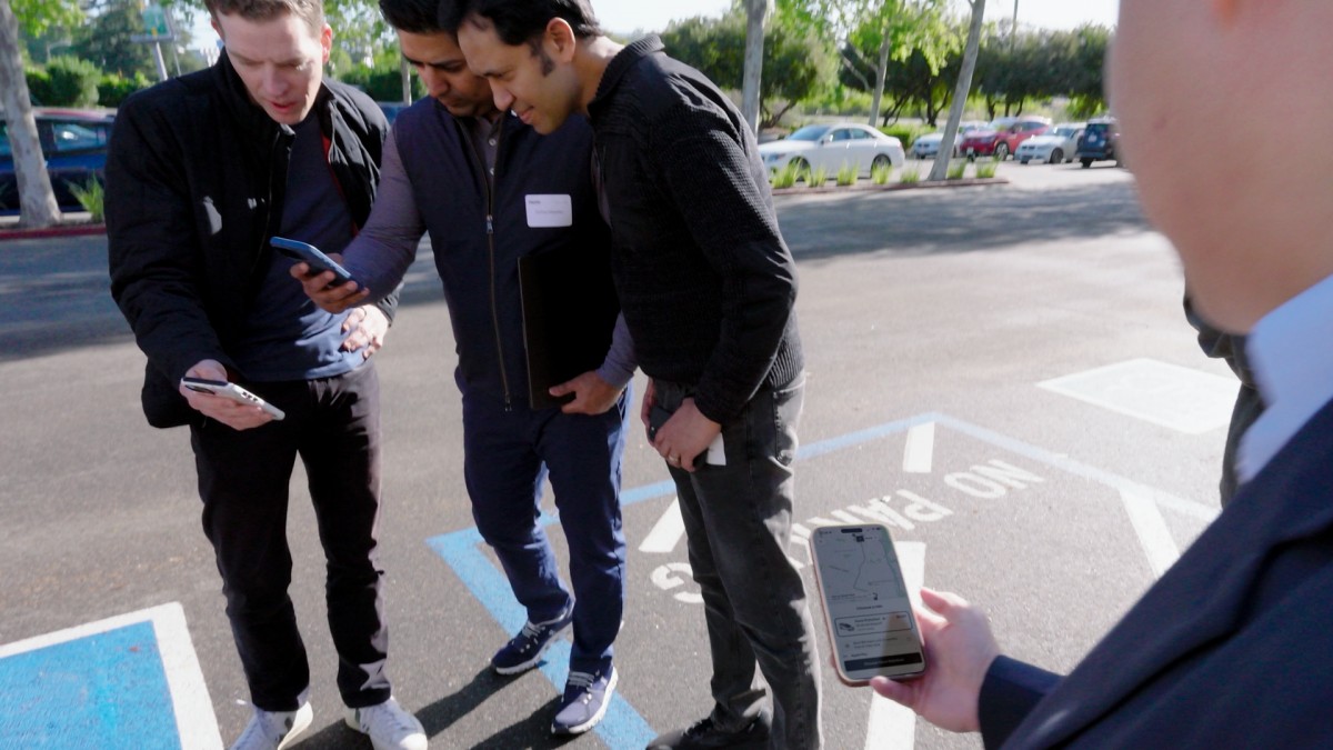 Uber employees booking a ride in Lucid Gravity