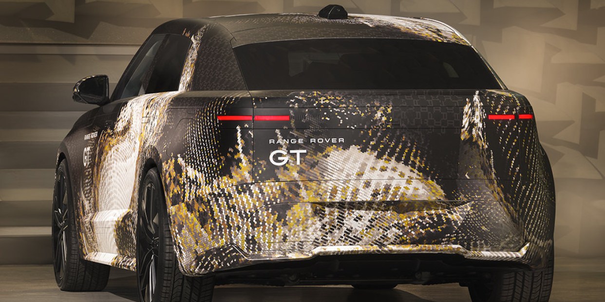 The upcoming Range Rover GT electric grand tourer testing with a sleek fastback silhouette
