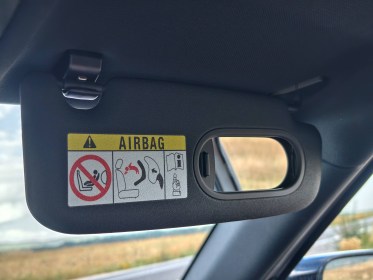 Laughably bad integrations for the armrest and sun visor mirror.